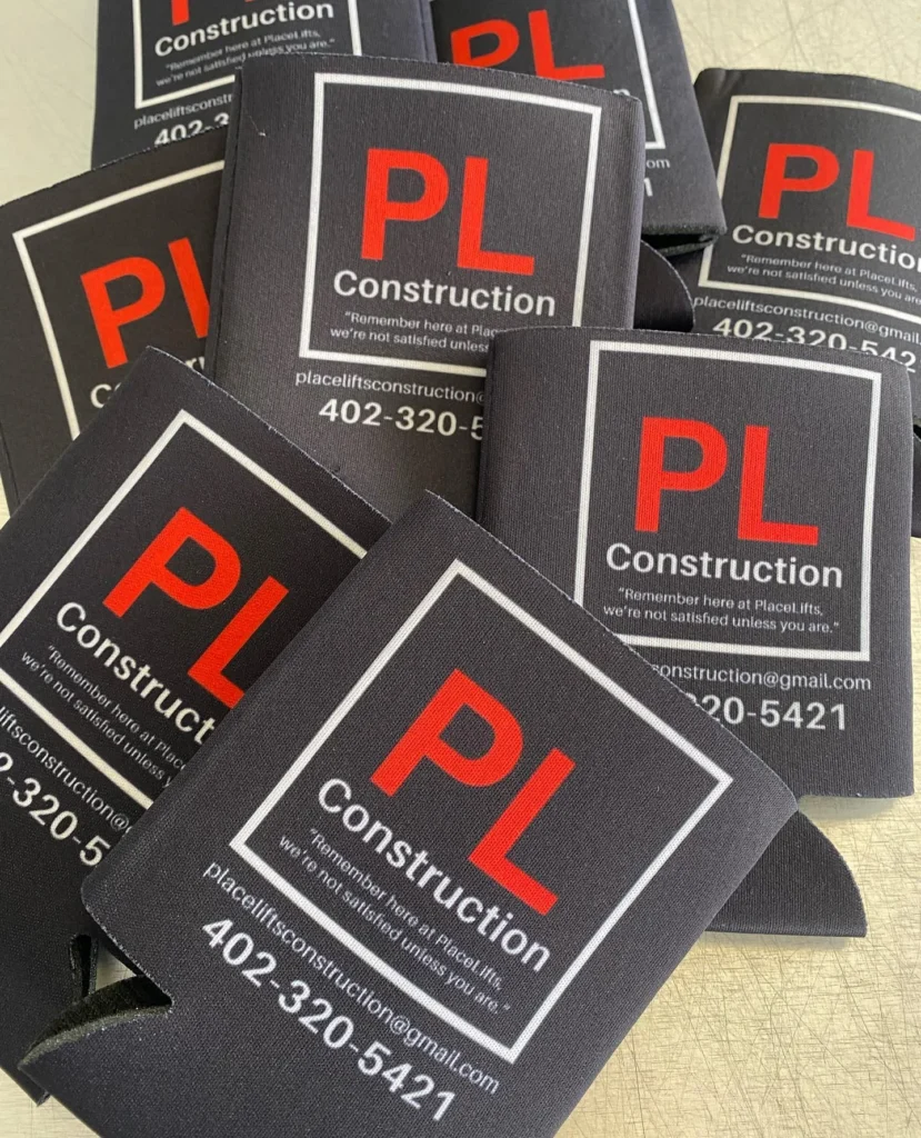 PL Construction can koozies with a red printed logo